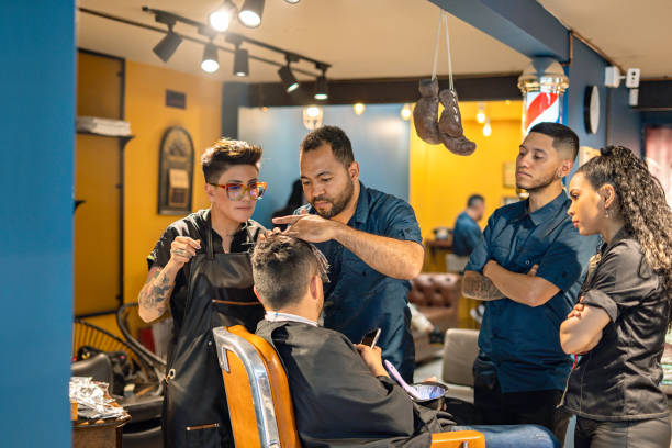 Barbers at work in a vibrant and busy barbershop.